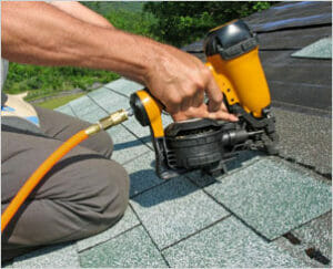 roof system being installed by nail gun