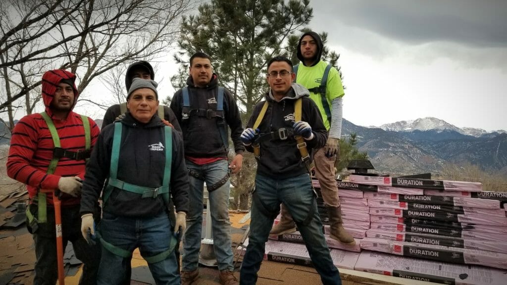 Roofers wearing winter gear